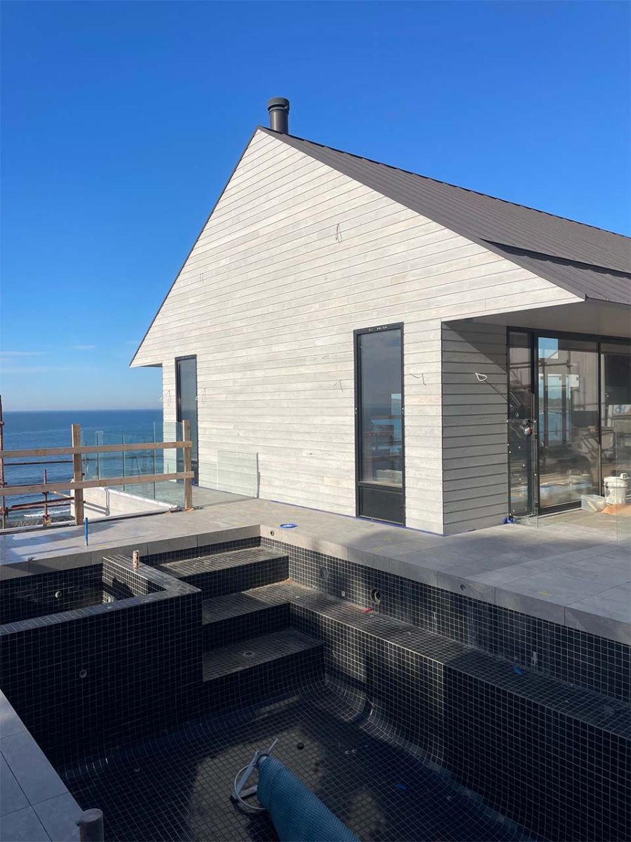 Coastal home featuring weathered timber cladding