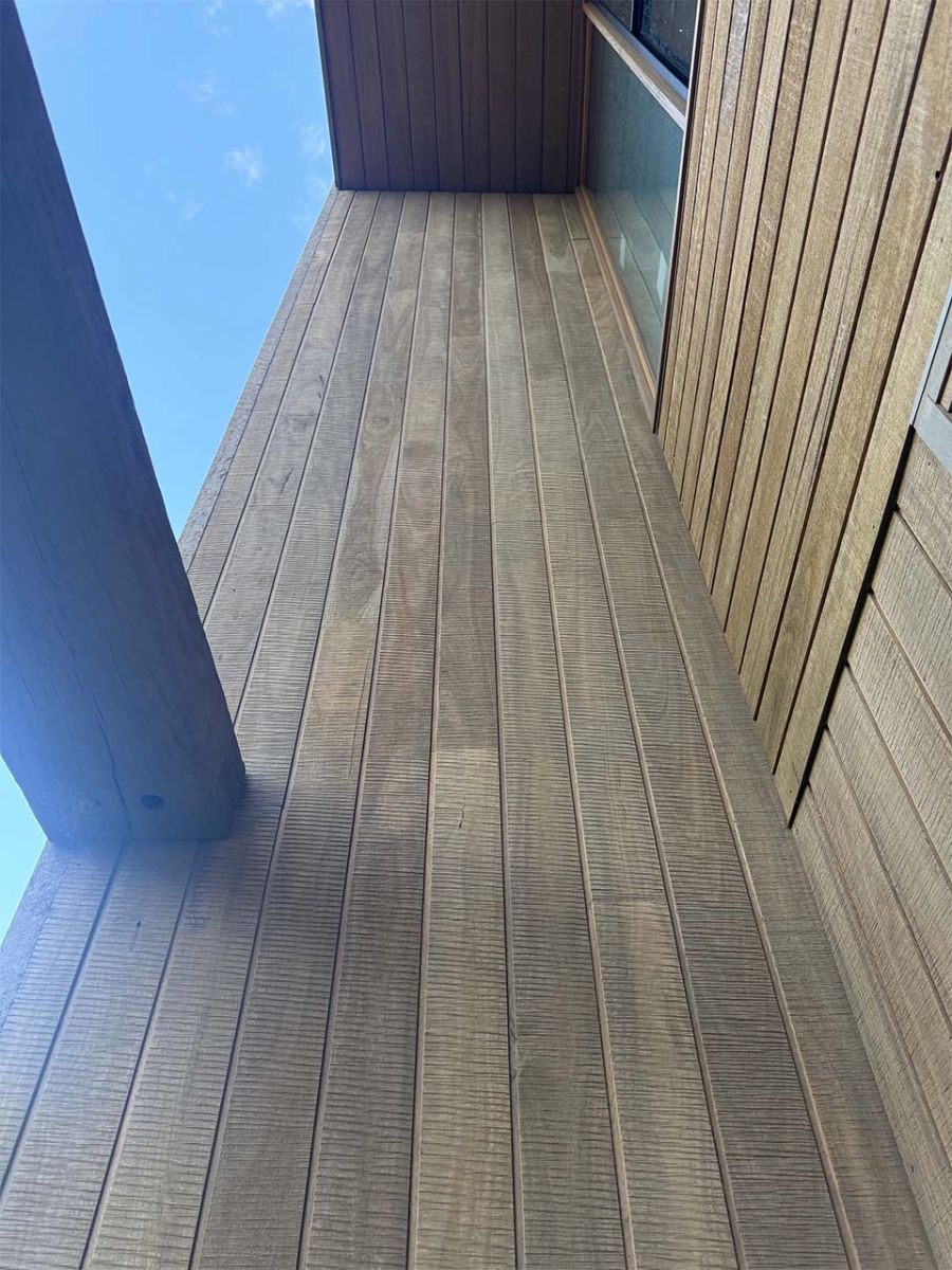 Weathered timber decking and external wall cladding